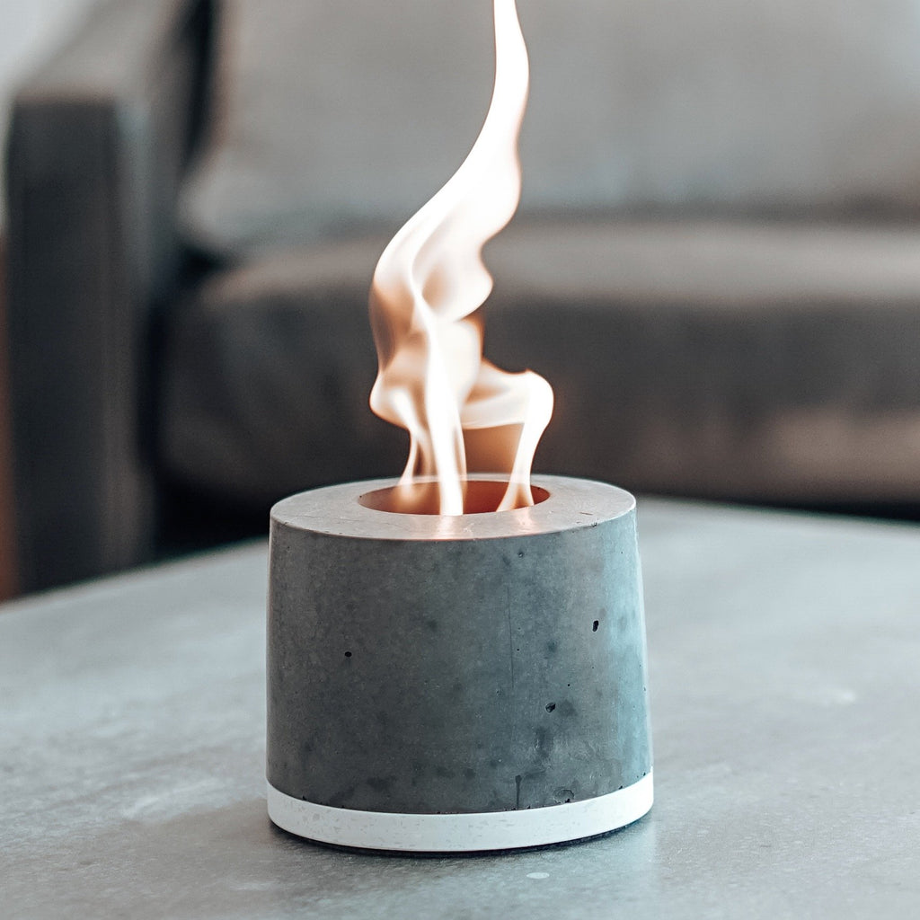 FLÎKR Fire2 Personal Concrete Fireplace On Table In Front Of Couch